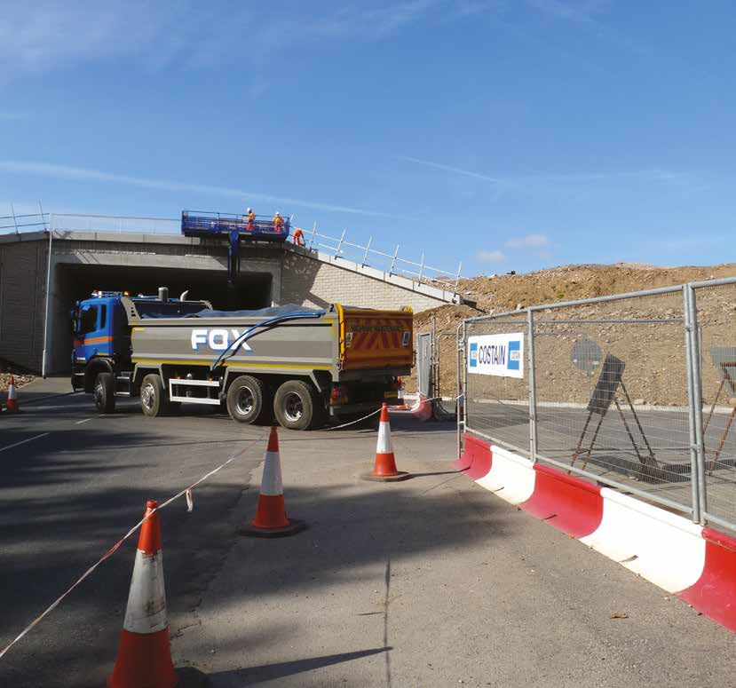 MASS barrier system on the Heysham to M6 link with a truck passing under a bridge