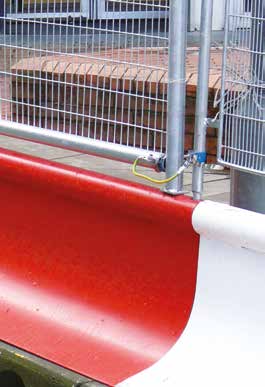 Close up of a red and white MASS barrier base unit